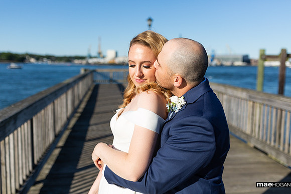 Bride and groom on pier in Portsmouth