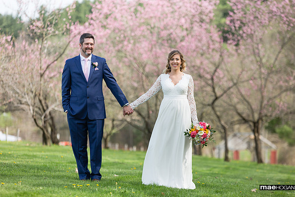 Bride and groom in orchard