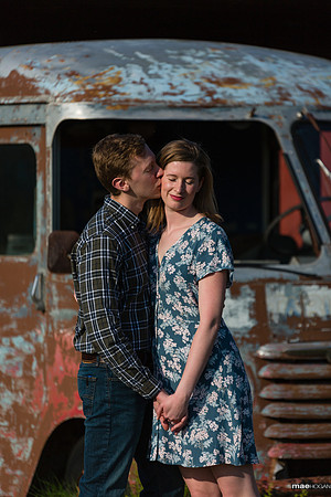 Engaged couple and an antique van