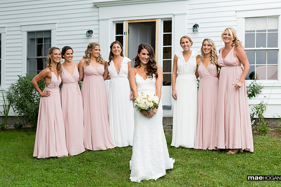 Bride and bridesmaids in front of Farmhouse